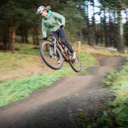 Fi riding the jumps, red taster trail, Glentress Scotland